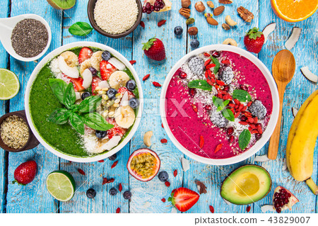 Smoothie bowl with fresh berries, nuts, seeds, fruit and vegetables. Smoothie bowl with fresh berries, nuts, seeds, fruit and vegetables. 43829007