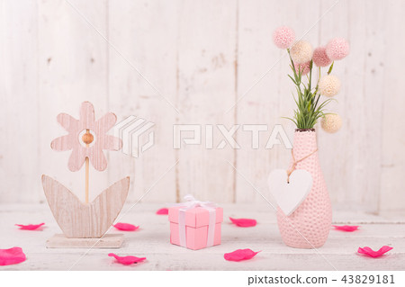 Flowers composition for Valentine's, Mother's or Women's Day. Pink flowers on old white wooden background. 43829181