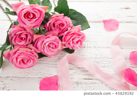 Flowers composition for Valentine's, Mother's or Women's Day. Pink flowers on old white wooden background. 43829192