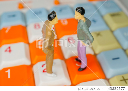 Men facing each other on a calculator 43829577