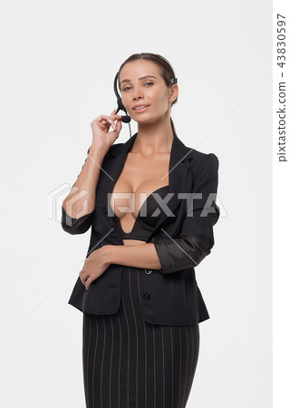 Lady with deep neckline and head microphone 43830597