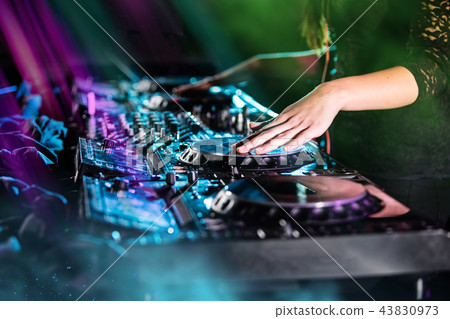 Dj mixes the track in the nightclub at a party 43830973