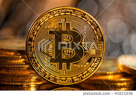 Bitcoin gold coin with defocused abstract background. Virtual cryptocurrency concept. 43831036