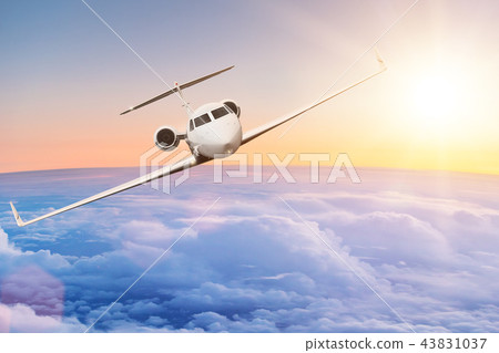 Commercial airplane flying above clouds. 43831037