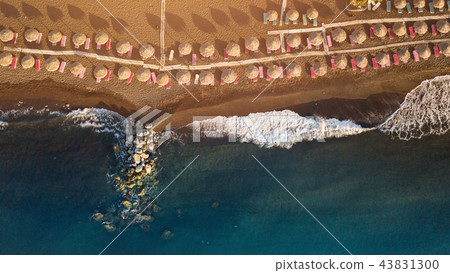 Perissa beach during sunrise on the Greek island of Santorini. 43831300
