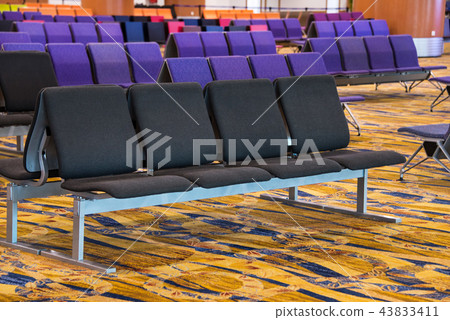 A row of chair at the lobby of airport 43833411