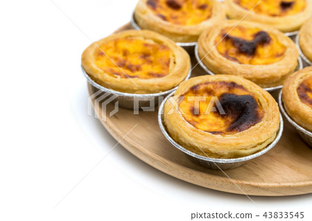 egg tart in aluminum foil cup isolated on white  43833545