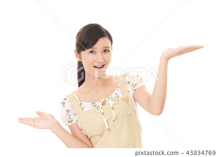 A woman in an apron A woman in an apron 43834769