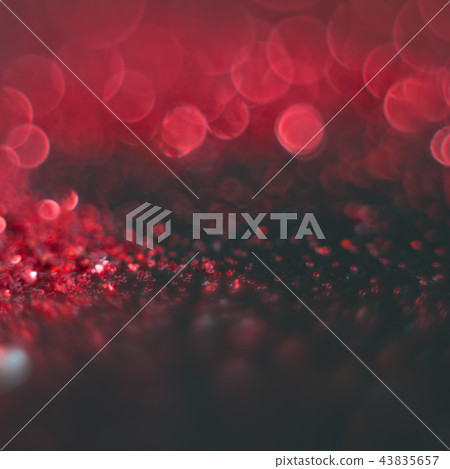 Abstract red bokeh on a black background. Defocused. 43835657