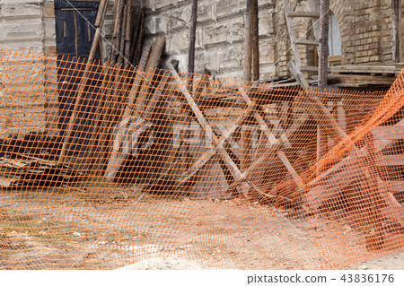 fenced with orange plastic fenced with orange plastic 43836176