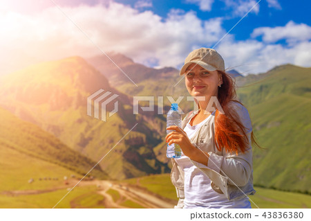 Woman drinking water in summer sunlight 43836380