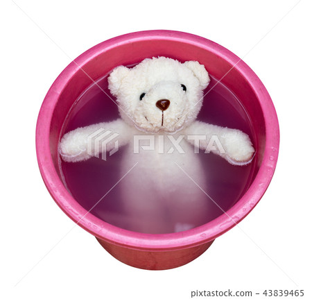 Washing teddy bear in water bucket Washing teddy bear in water bucket 43839465