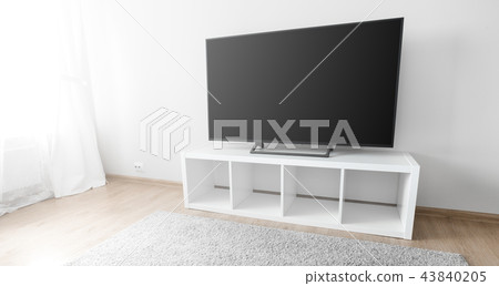 Lcd tv on white shef at modern room interior 43840205