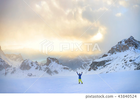 Winter snowboarding activity in high Italian Alps 43840524
