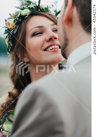 young groom and bride standing hugging young groom and bride standing hugging 43842174