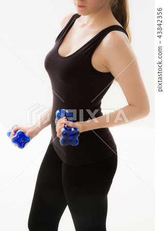 Young woman exercising Young woman exercising 43842356