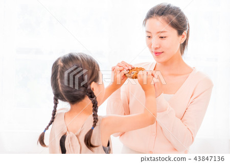Mother and Child enjoying home baking Mother and Child enjoying home baking 43847136