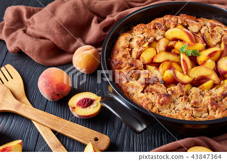 Close up of breakfast dessert peach crumble Close up of breakfast dessert peach crumble 43847364