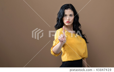 Young woman pointing at something Young woman pointing at something 43847419