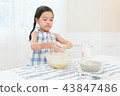 A girl enjoying home baking 43847486