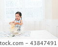 A girl enjoying home baking 43847491