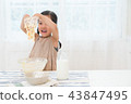 A girl enjoying home baking 43847495