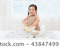 A girl enjoying home baking 43847499