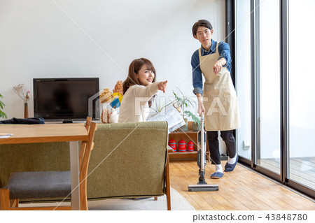 Husband and wife cleaning holiday 43848780