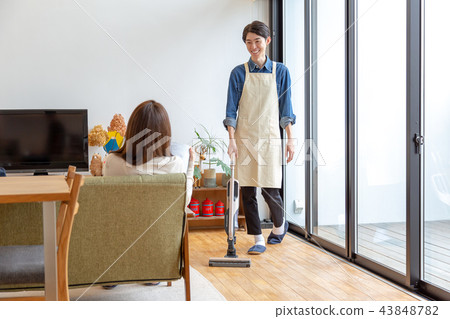 Husband and wife cleaning holiday 43848782