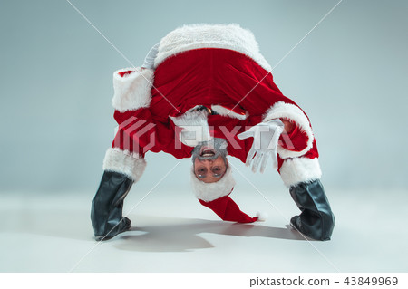 Funny guy in christmas hat. New Year Holiday. Christmas, x-mas, winter, gifts concept. Funny guy in christmas hat. New Year Holiday. Christmas, x-mas, winter, gifts concept. 43849969