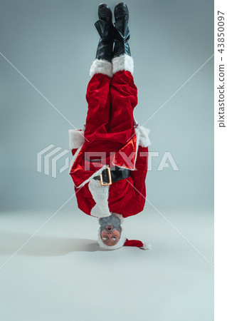Funny guy in christmas hat. New Year Holiday. Christmas, x-mas, winter, gifts concept. 43850097