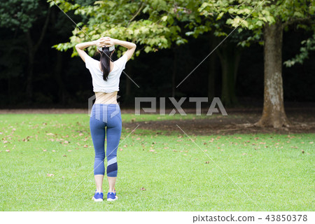 Women exercising in the park Women exercising in the park 43850378