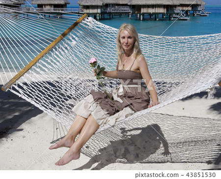 woman with blonde long hair in  long dress with a 43851530