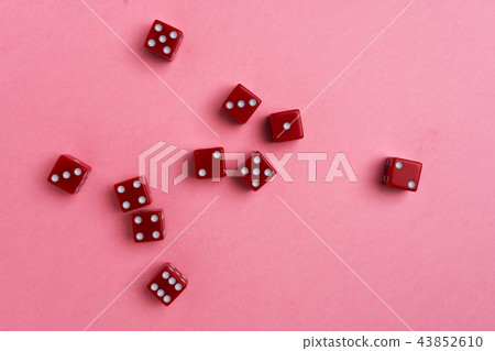 Red gaming dices on pink background 43852610