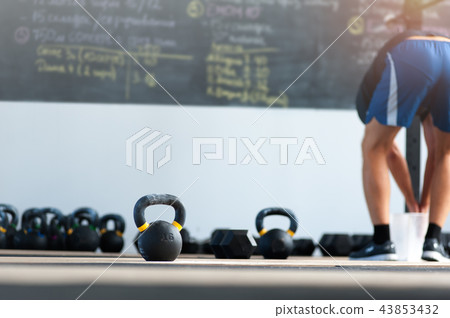 Workout with kettlebells 43853432