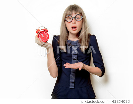 nerd girl in glasses with alarm clock nerd girl in glasses with alarm clock 43854053