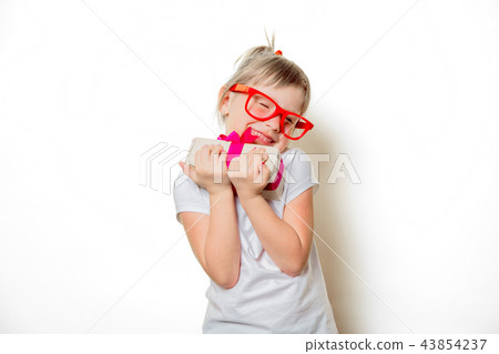 toddler girl in glasses with gift box toddler girl in glasses with gift box 43854237