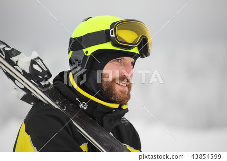 Portrait of a happy male skier Portrait of a happy male skier 43854599