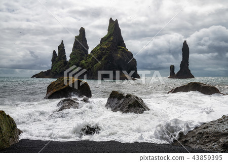 Basalt rock formations Reynisdrangar, Vik, Iceland 43859395