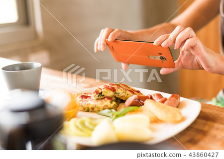 taking photo at breakfast 43860427