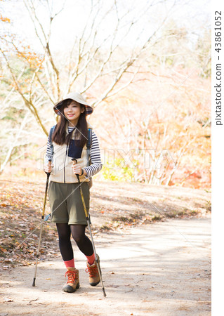 A woman trekking A woman trekking 43861052