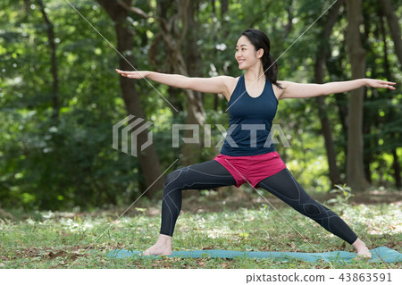 Young Japanese woman doing yoga in nature 43863591