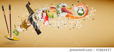 Pieces of delicious japanese sushi frozen in the air. 43864457