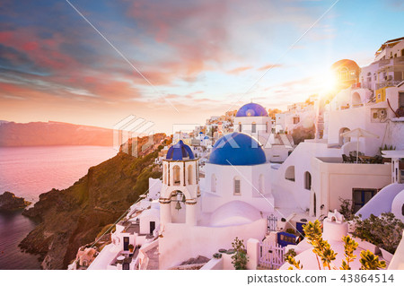 Sunset view of the blue dome churches of Santorini, Greece. 43864514