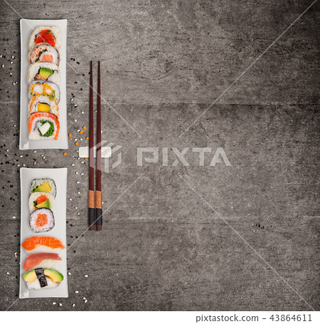 Traditional japanese sushi pieces on rustic concrete background. 43864611