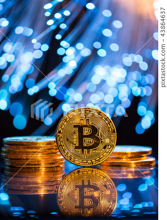 Bitcoin gold coin with defocused abstract background. Virtual cryptocurrency concept. Bitcoin gold coin with defocused abstract background. Virtual cryptocurrency concept. 43864637