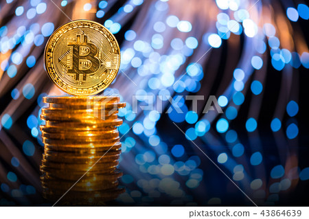Bitcoin gold coin with defocused abstract background. Virtual cryptocurrency concept. Bitcoin gold coin with defocused abstract background. Virtual cryptocurrency concept. 43864639