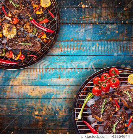 Barbecue grill with beef steaks, close-up. 43864644