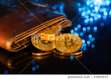 Bitcoin gold coins with wallet. Virtual cryptocurrency concept. Bitcoin gold coins with wallet. Virtual cryptocurrency concept. 43864655