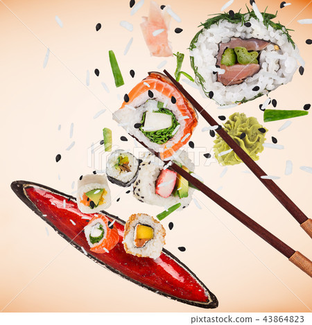 Pieces of delicious japanese sushi frozen in the air. 43864823